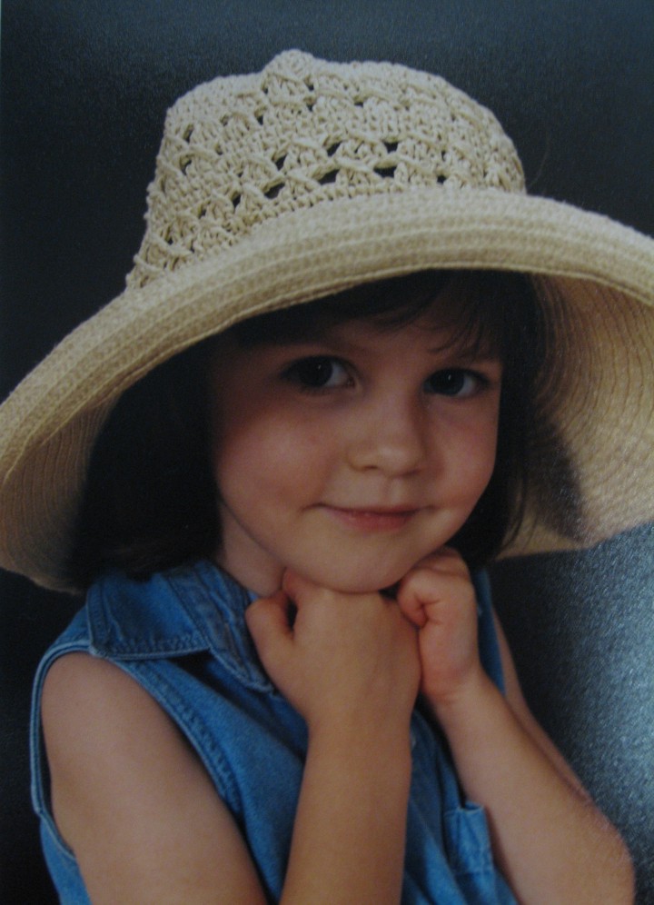 Little girl (Kelly Corbly) with floppy straw hat